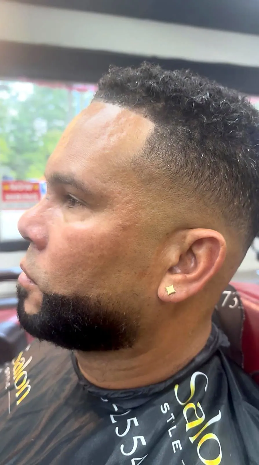 Curly top fade with full beard