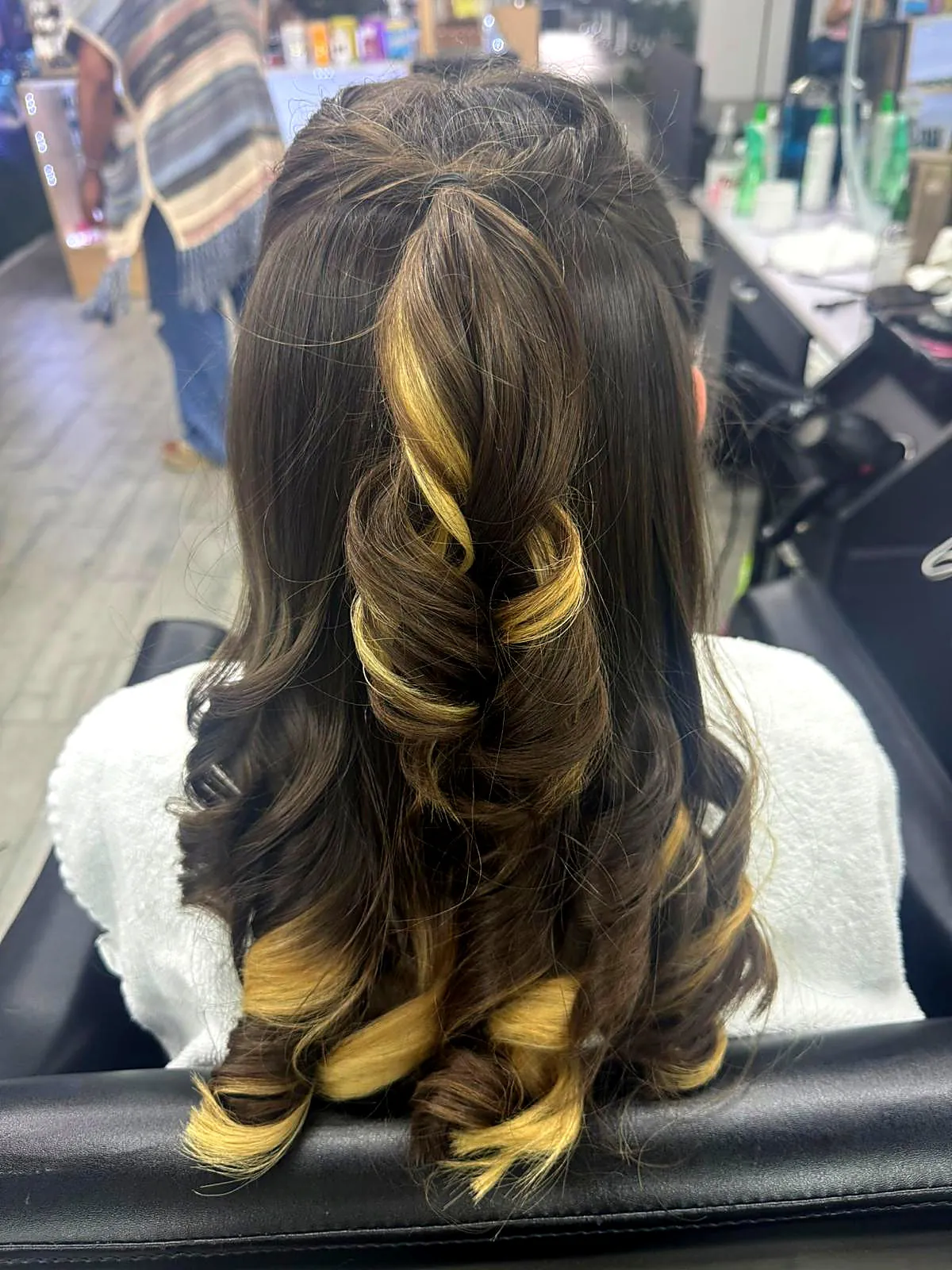 Long voluminous curls with highlights