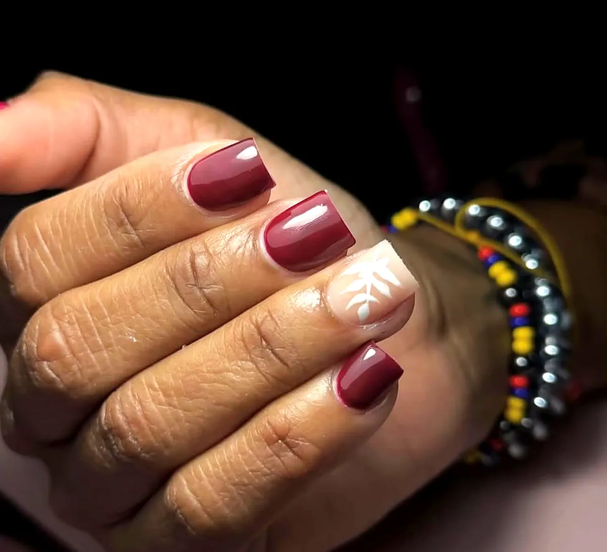 Burgundy gel with leaf accent
